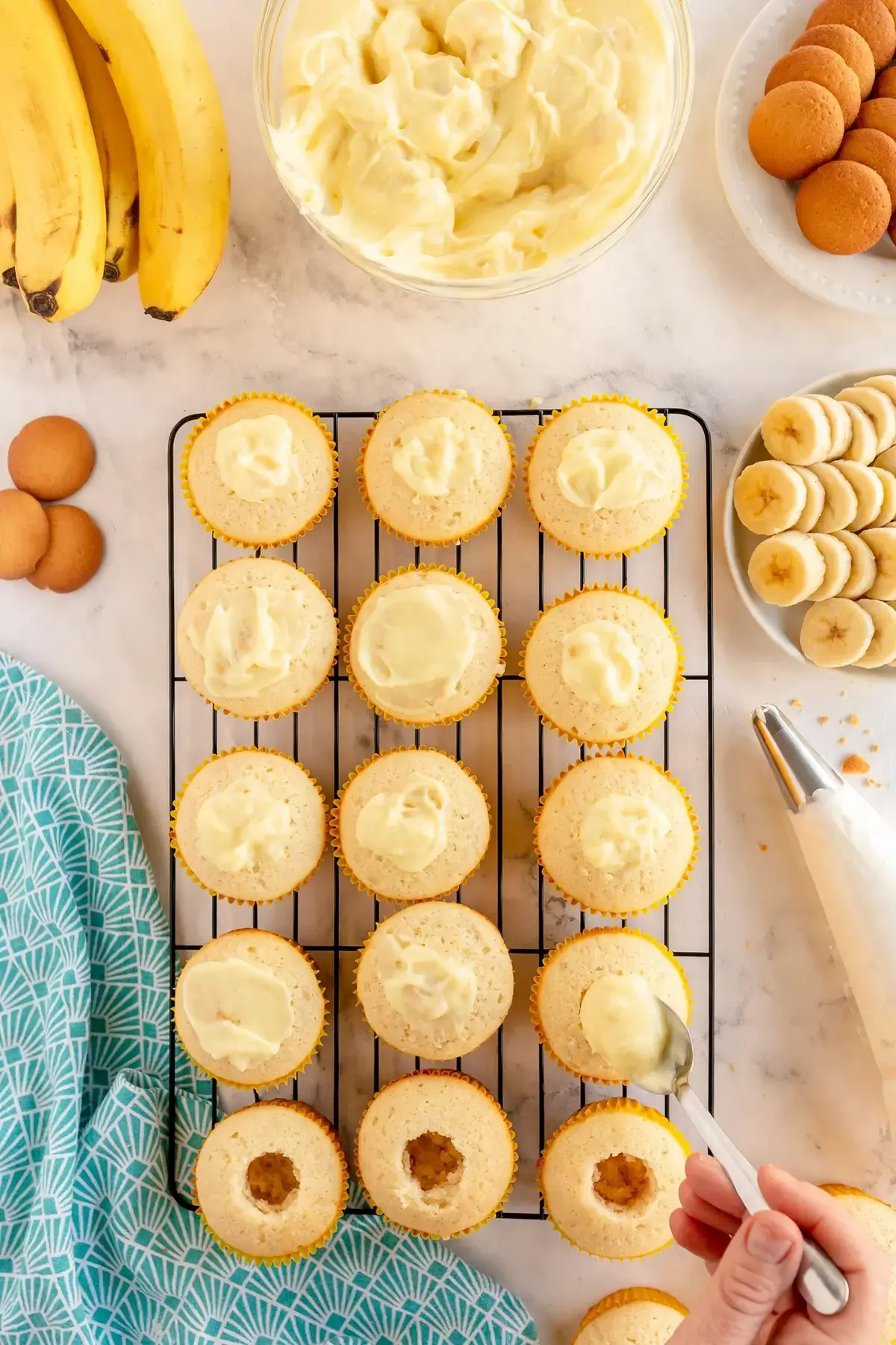 Easy Banana Pudding Cupcakes with Whipped Cream and Wafer Topping 19 Easy Banana Pudding Cupcakes, 3 , Fill the banana pudding cupcakes