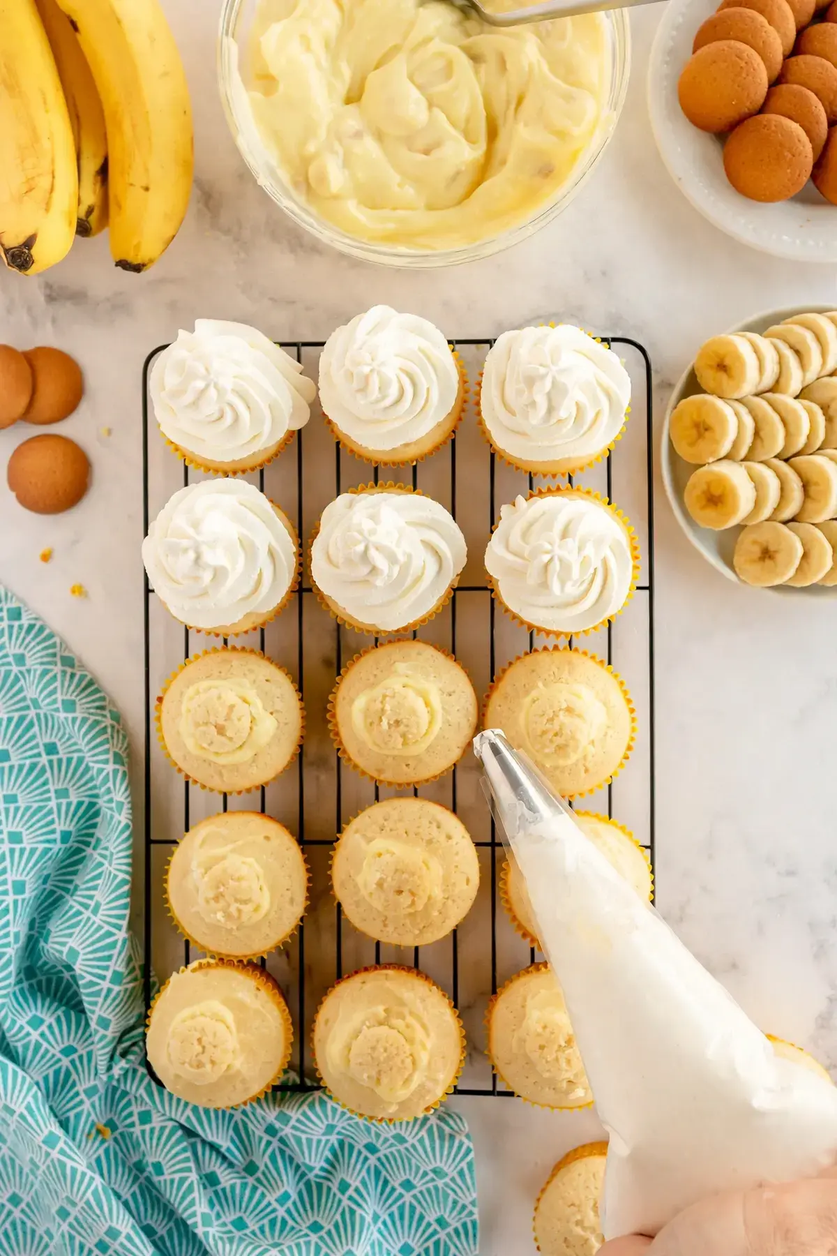 Easy Banana Pudding Cupcakes with Whipped Cream and Wafer Topping 21 Easy Banana Pudding Cupcakes, 5 , Frost & Decorate the Banana Pudding cupcakes