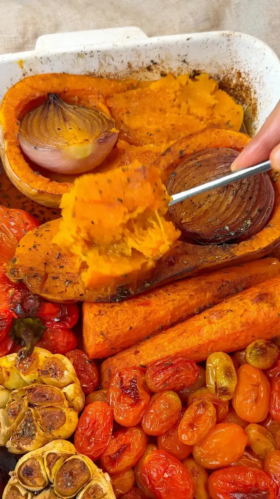 Scooping the roasted squash flesh